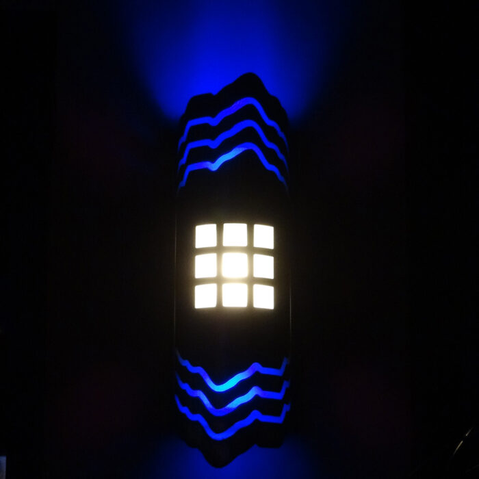 an image of the a blue illuminated wall sconce at Badlands Nightclub