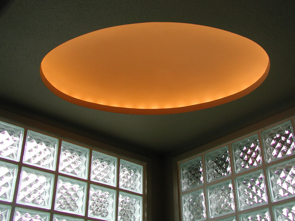 an image of a spa with an illuminated orange disc above it