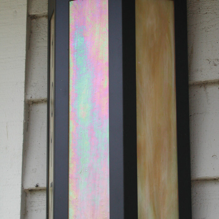 an image of a hexagonal shaped illuminated wall sconce mounted on a wall