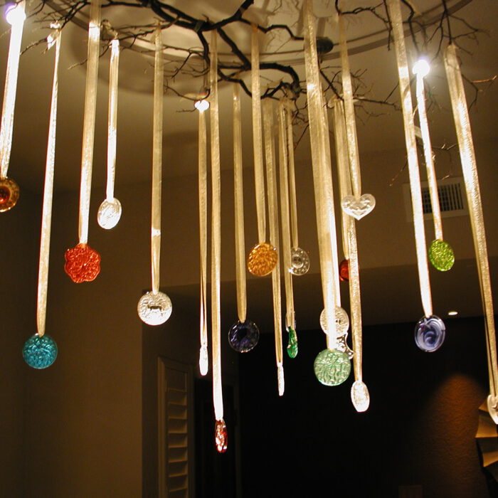 a lighting installation that resembles hanging crystal medallions