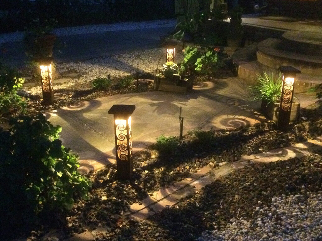 Sidewalk lighting with cool swirl shadows