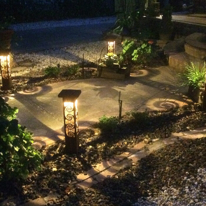 Sidewalk lighting with cool swirl shadows